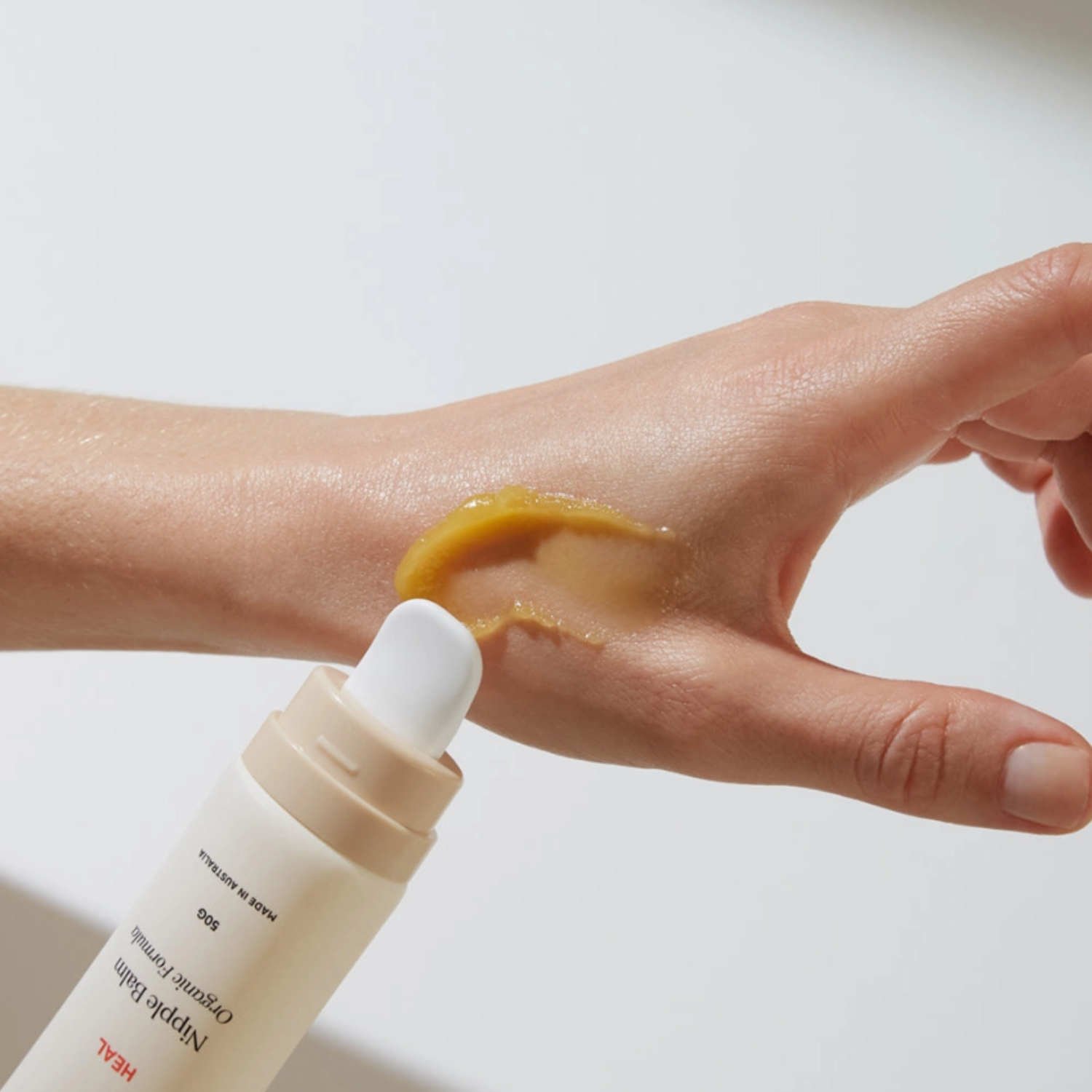 Marigold HEAL restorative nipple balm with ceramic applicator for soothing, protecting, and nourishing breastfeeding skin